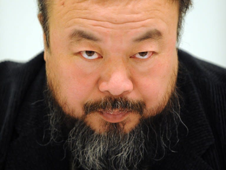 Chinese artist Ai Weiwei answers journalists questions during a press conference in Beijing, on October 15, 2009. A map of China made from more than 1,800 cans of baby formula created by Ai has gone on show in Hong Kong, reflecting the controversy over mainland demand for milk powder