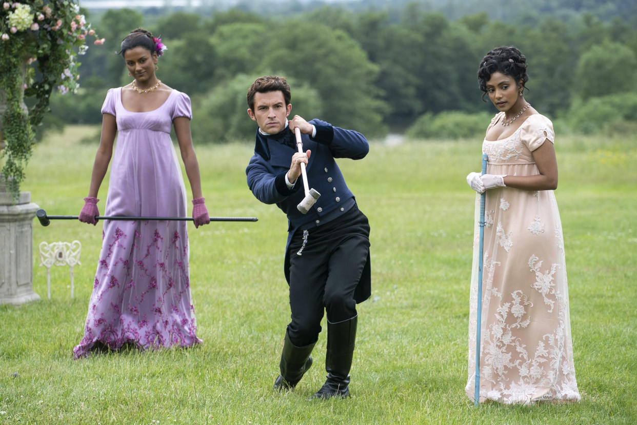 Pictured, l-r: Simone Ashley as Kate Sharma, Jonathan Bailey as Anthony Bridgerton, Charithra Chandran as Edwina Sharma in episode 203 of 