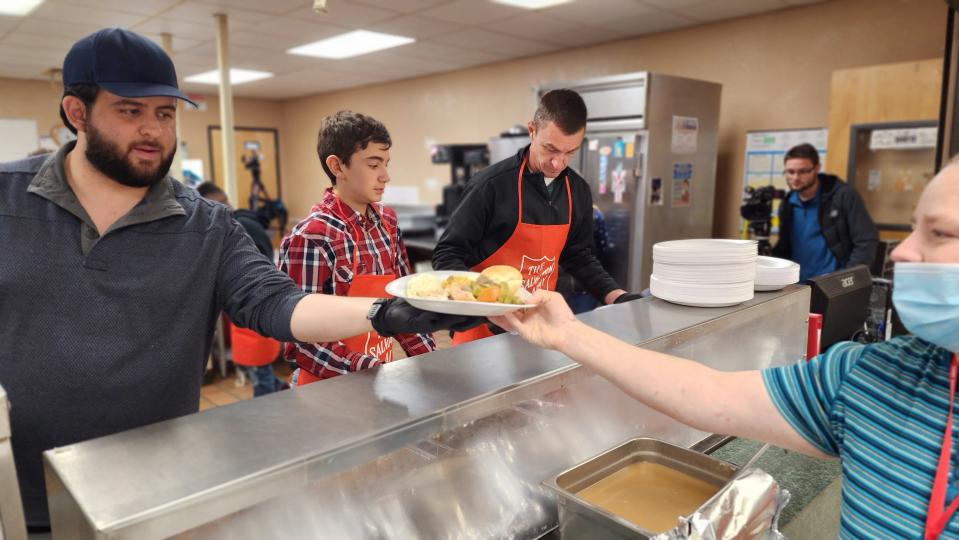 Volunteers prepare Thanksgiving dinner Thursday for residents of the Salvation Army Shelter in downtown Amarillo.