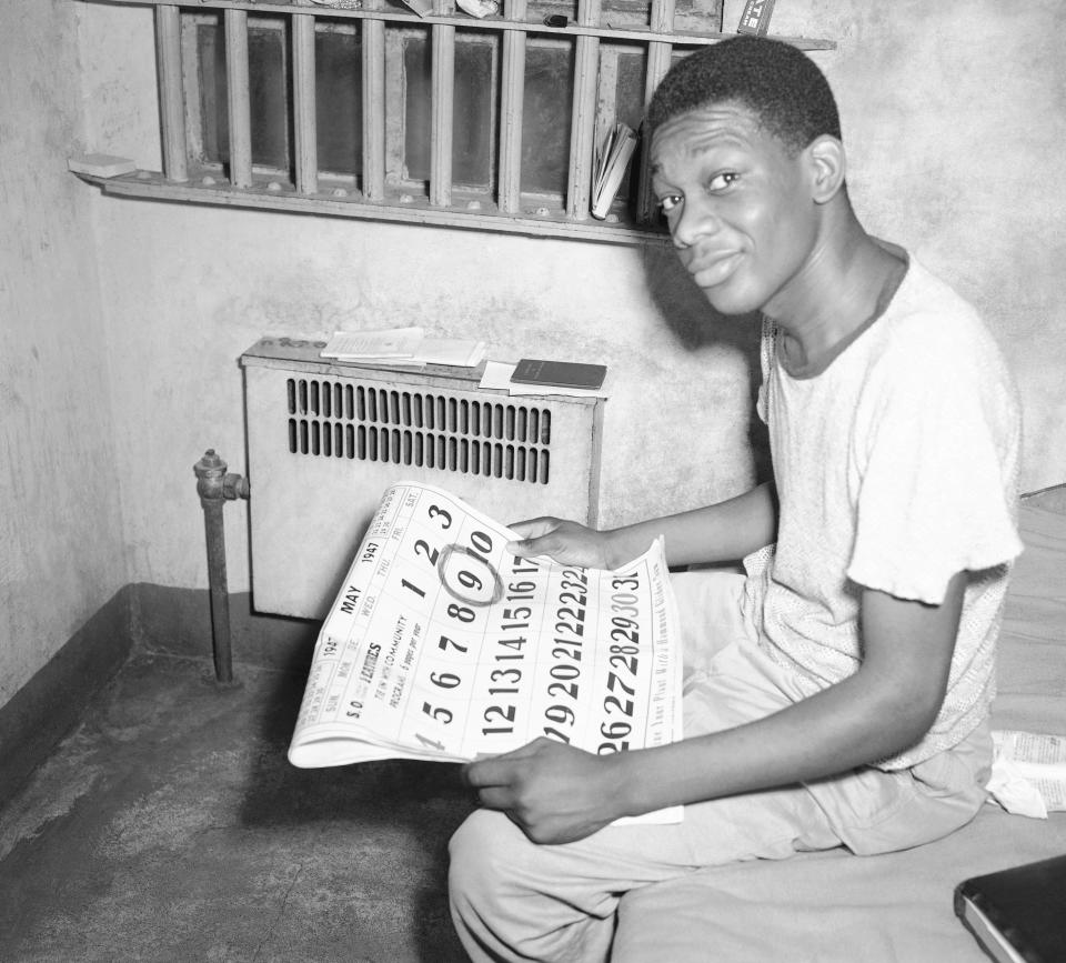 FILE - Willie Francis, who escaped death when the first attempt to electrocute him failed because of a faulty electric chair, counts the days in a jail in New Iberia, La., until the second attempt to electrocute him, May 4, 1957. In Louisiana, around 60 people currently sit on death row, but an execution hasn't occurred since 2010. Between a conservative governor and a new execution method, there has been a renewed push to find alternatives to lethal injection. (AP Photo, File)