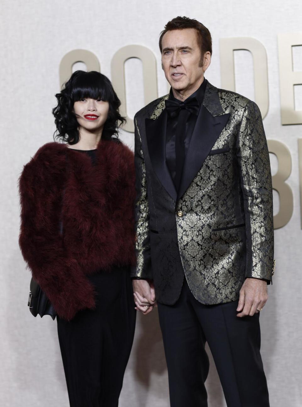 Riko Shibata and Nicolas Cage on the red carpet of the 81st Annual Golden Globe Awards