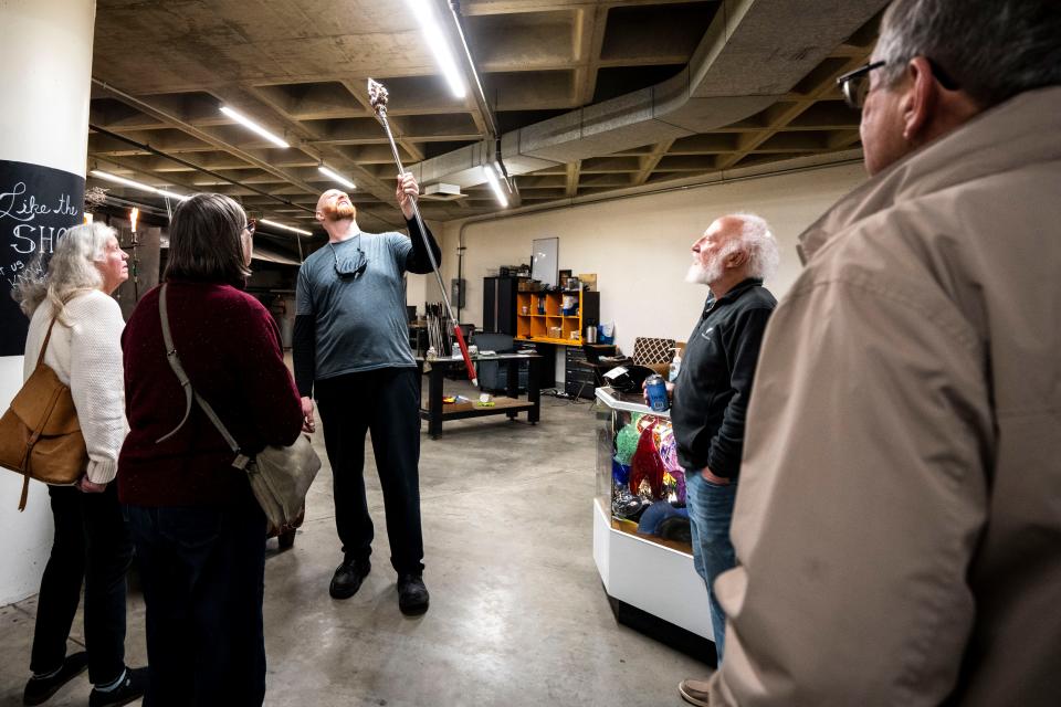 JJ Gaffers performs a glass blowing demonstration during First Friday at Mainframe Studios on Friday, Dec. 1, 2023, in Des Moines.