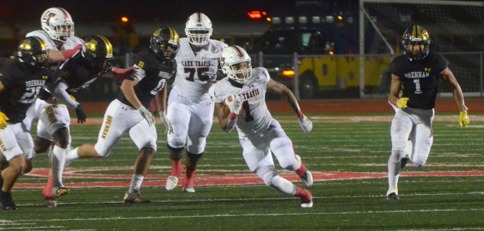 Lake Travis running back Nico Hamilton outruns a quartet of San Antonio Brennan defenders for yardage in the second quarter of Friday's playoff game. Hamilton rushed for 158 yards, but Brennan won 34-17.