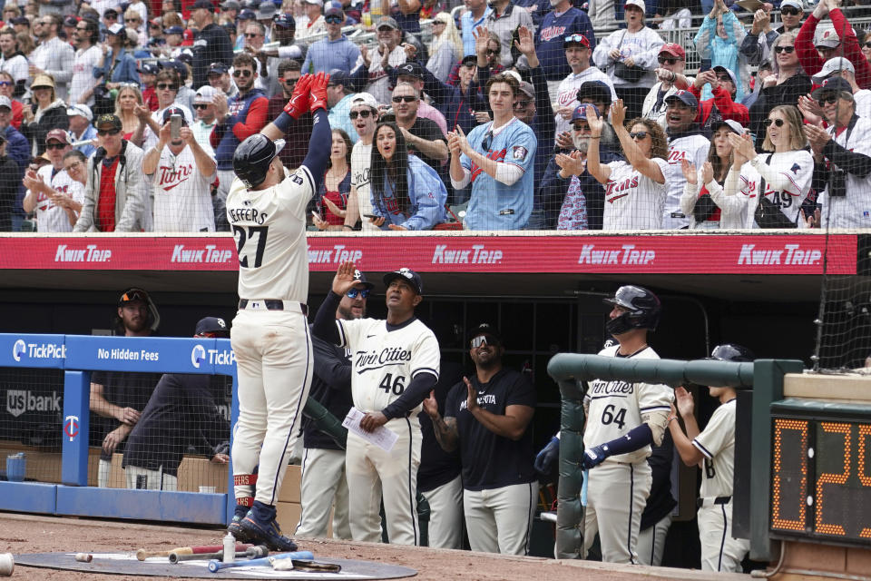 Minnesota Twins' Ryan Jeffers gestures to the crowd after hitting a home run off of Seattle Mariners pitcher Logan Gilbert during the second inning of a baseball game, Thursday, May 9, 2024, in Minneapolis. The Twins won 11-1. (AP Photo/Craig Lassig)