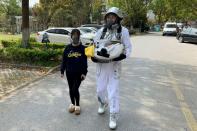 Cao Junjie walks around a residential compound to demonstrate for the camera a safety pod he created to protect his two-month old baby from the coronavirus disease (COVID-19), in Shanghai