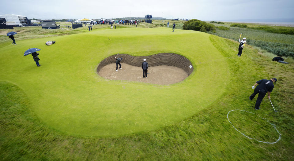 Denmark's Rasmus Hojgaard plays out of a bunker on the 17th green during a practice round for the British Open Golf Championships at the Royal Liverpool Golf Club in Hoylake, England, Tuesday, July 18, 2023. The Open starts Thursday, July 20. (AP Photo/Jon Super)