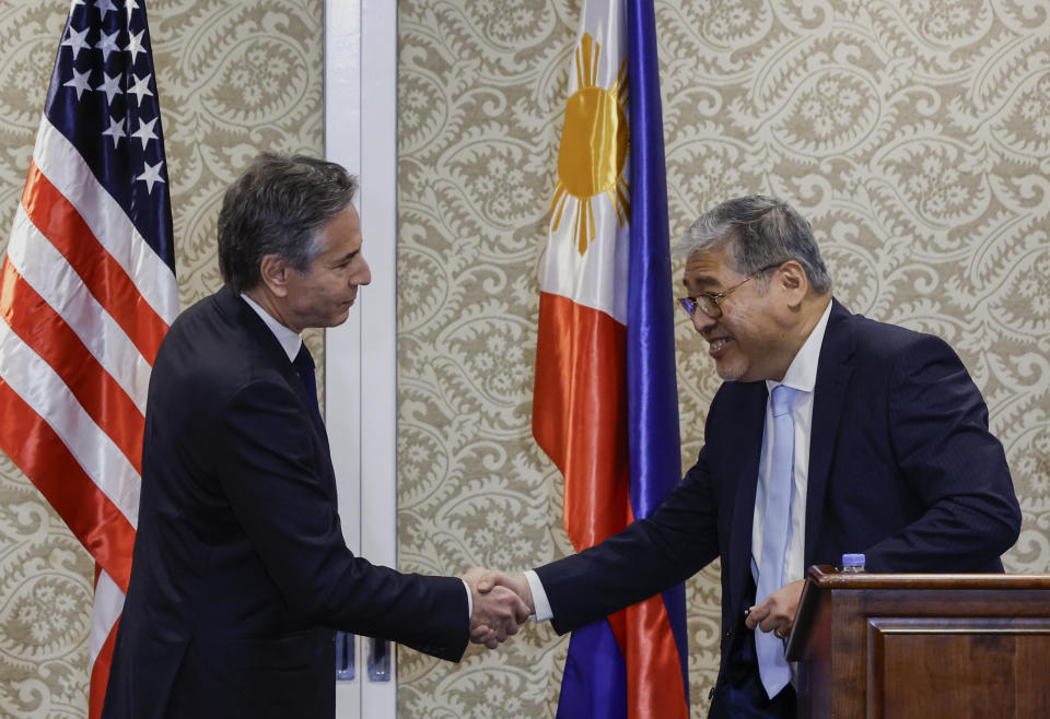 U.S. Secretary of State Antony Blinken, left, and Philippines' Secretary of Foreign Affairs Enrique Manalo shake hands during a joint press conference at the Sofitel Hotel in Manila, Philippines, March March 19, 2024. (Evelyn Hockstein/Pool Photo via AP)