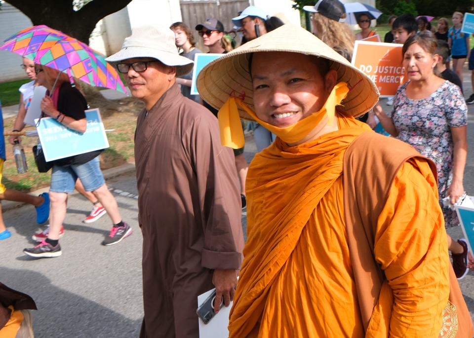 Buddhist monks take part in the Peace Walk on Sunday, Aug. 7, 2022, through OKC's Asian District.