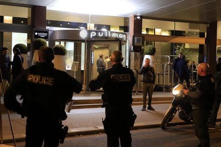 French police gather outside the Pullman Hotel at the end of an intervention as authorities continue to search for accomplices to Friday night's fatal series of shootings in Paris, France, November 14, 2015. REUTERS/Pascal Rossignol