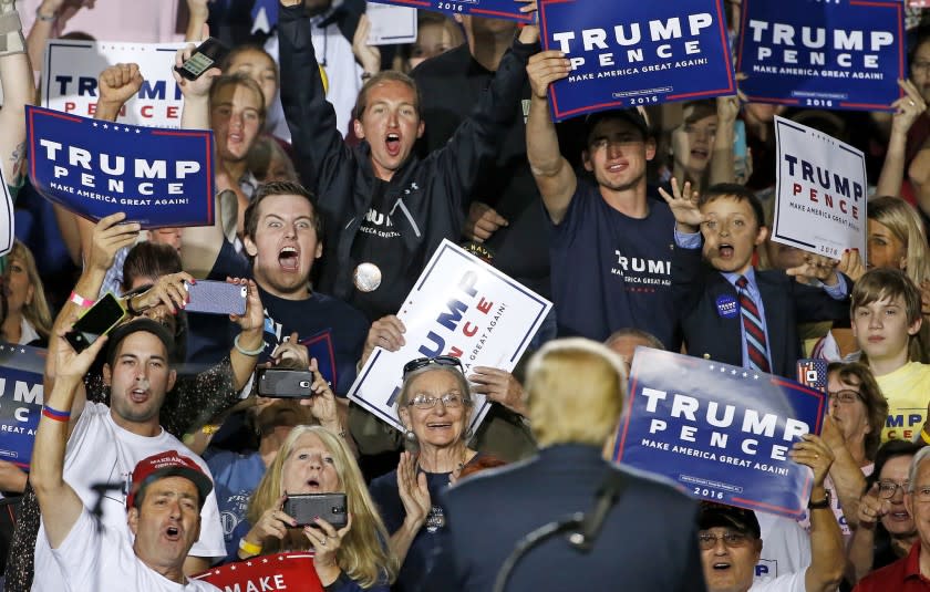 Supporters cheer Republican presidential candidate Donald Trump at a campaign rally Tuesday, Oct. 4, 2016, in Prescott Valley, Ariz.