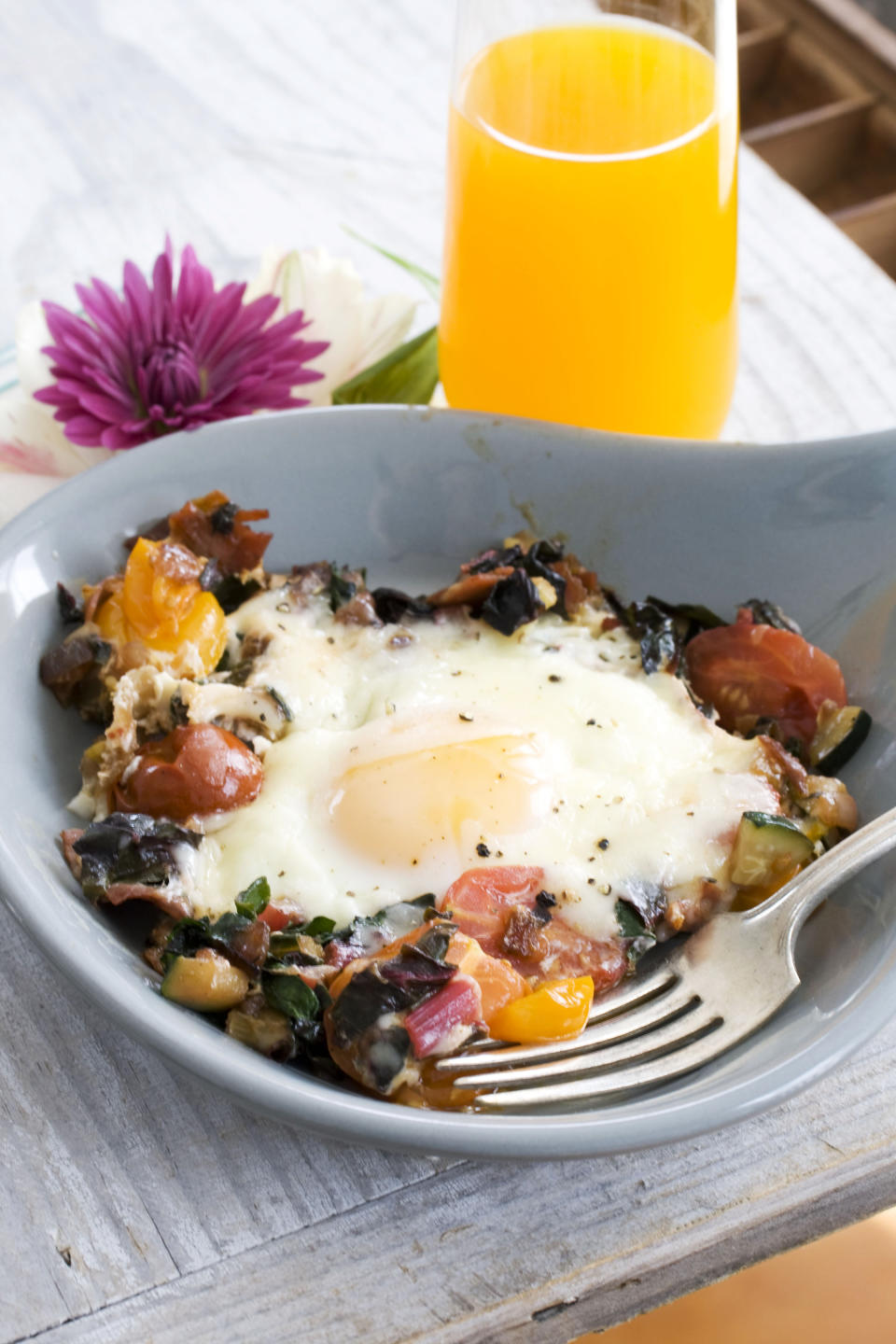 In this image taken on April 15, 20133, skillet garden eggs with fontina are shown in Concord, N.H. (AP Photo/Matthew Mead)