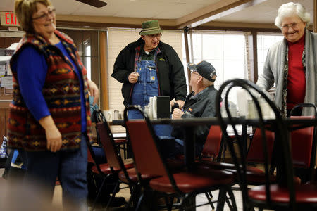Ranchers tease each other as they gather for breakfast in a cafe in Buffalo, Oklahoma, U.S., March 13, 2017. REUTERS/Lucas Jackson