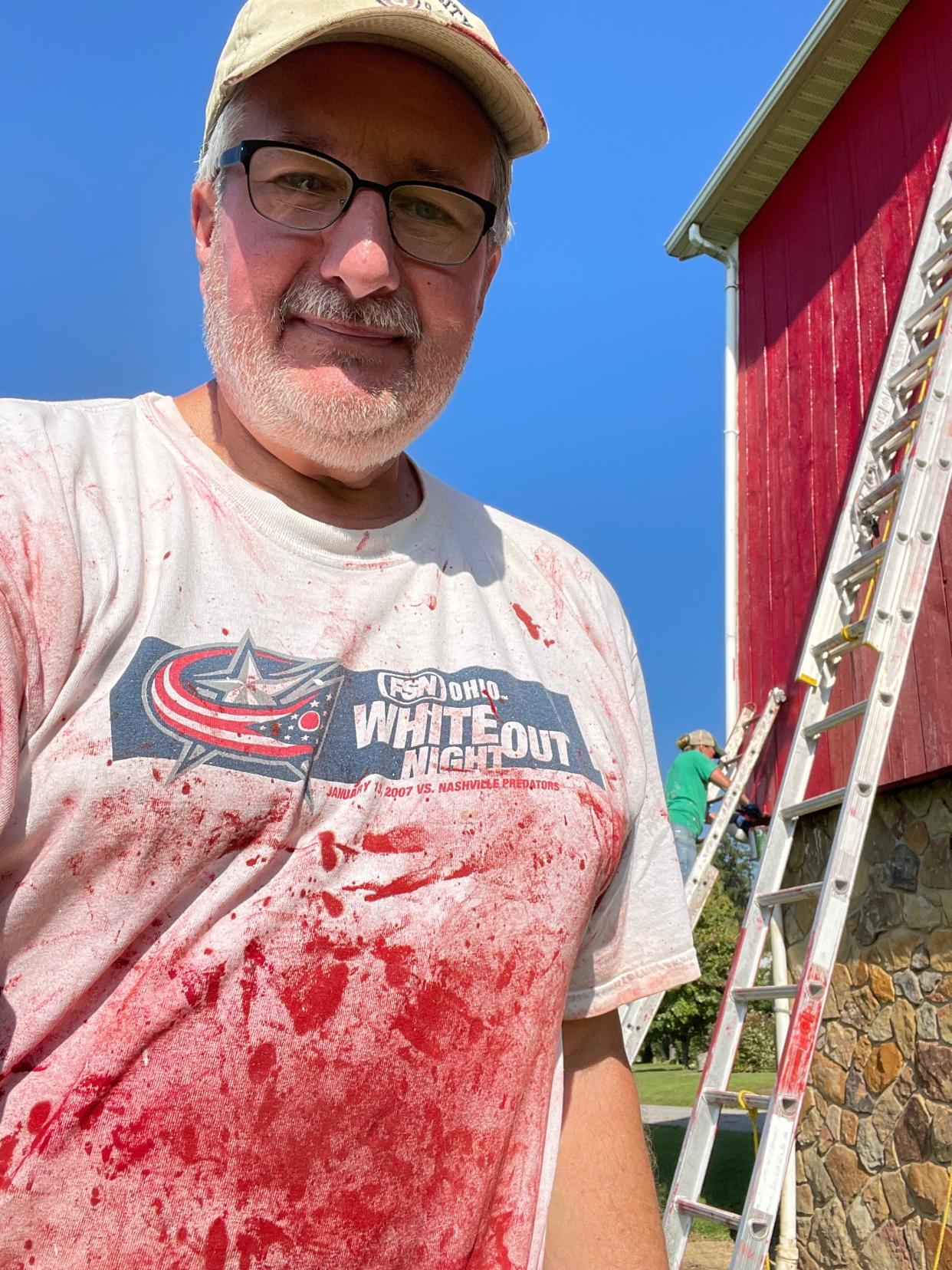 Alan Miller's favorite shirt for painting the old red barn has drawn stares from people wondering if they should call 911.