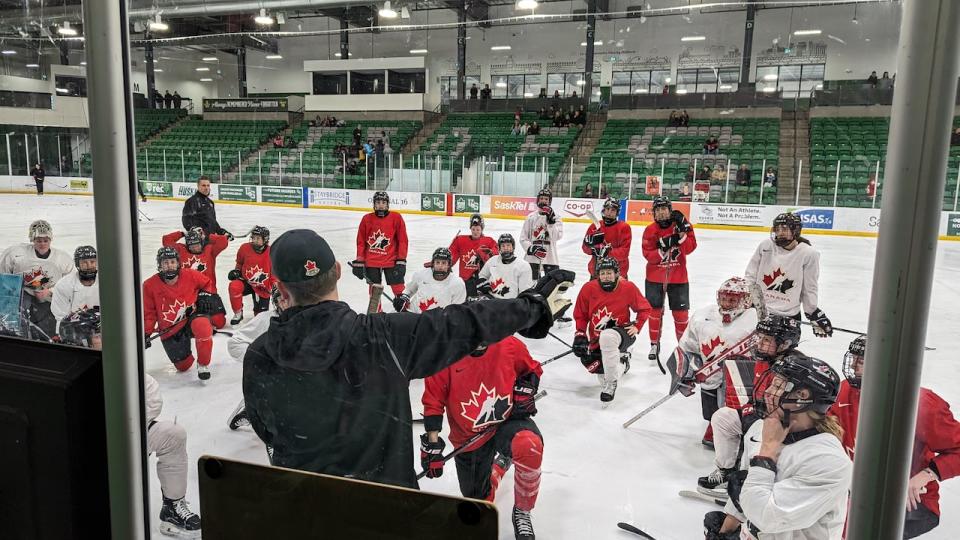 Team Canada women's hockey coach Troy Ryan instructs the players on a new drill near the beginning of Tuesday's practice at Merlis Belsher Place in Saskatoon.