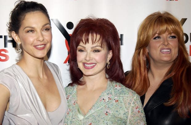 Ashley Judd, Naomi Judd and Wynonna Judd<p><a href="https://www.gettyimages.com/detail/105257630" rel="nofollow noopener" target="_blank" data-ylk="slk:Theo Wargo/Getty Images;elm:context_link;itc:0;sec:content-canvas" class="link ">Theo Wargo/Getty Images</a></p>