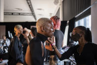 Models get their hair and makeup done backstage at The Blonds fashion show at Spring Place on Wednesday, Sept. 14, 2022, in New York. (AP Photo/Brittainy Newman)