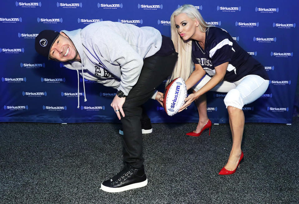 <p>McCarthy’s hot hubby, Boston native Donnie Wahlberg, hiked the ball to her in a fun game of football. Naturally, she wore heels! (Photo: Cindy Ord/Getty Images for SiriusXM) </p>