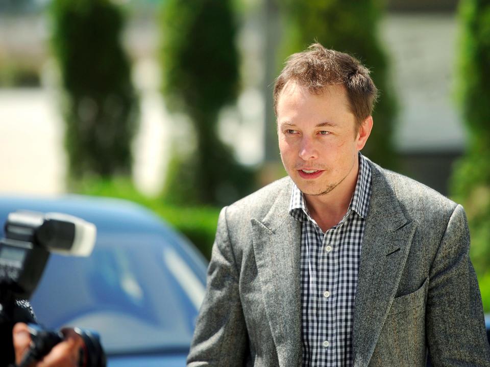 elon musk tesla face intense outside