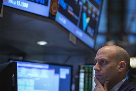 A trader works on the floor of the New York Stock Exchange February 4, 2014. REUTERS/Brendan McDermid