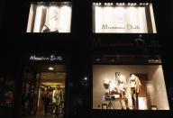 Women walk out of a Massimo Dutti clothes store on the Garosugil or the Tree-Lined Street in the Gangnam area of Seoul.