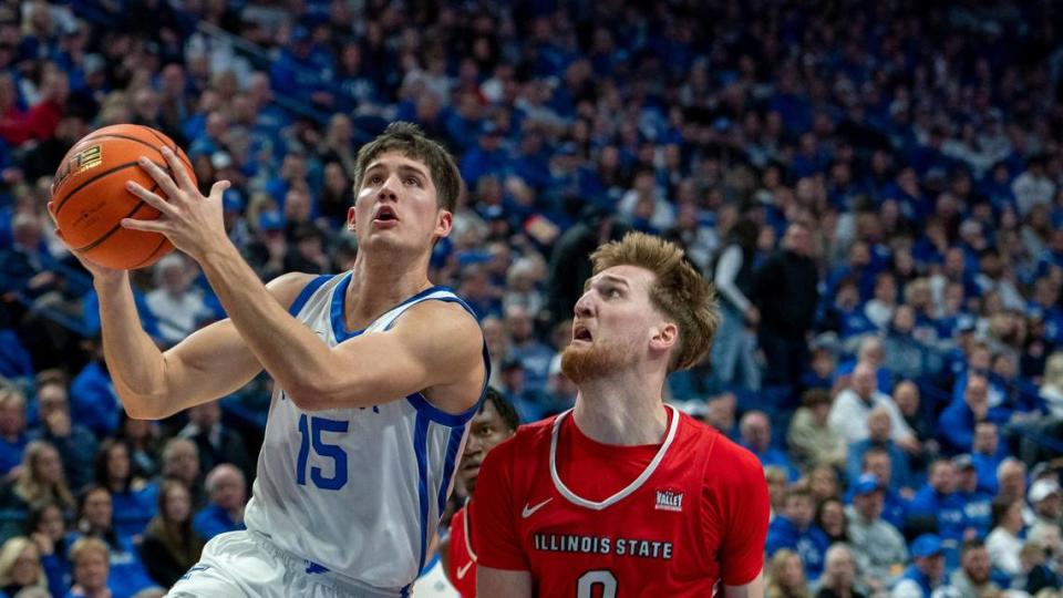 Kentucky guard Reed Sheppard (15) drives to the basket as Illinois State guard Luke Kasubke defends Friday at Rupp Arena.