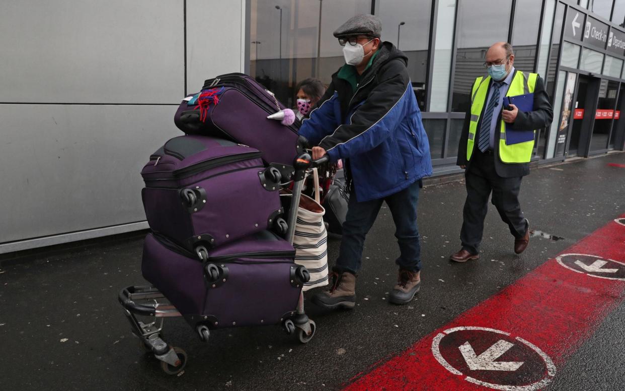 Chun Wong and his daughter Kiernan were among the first arrivals at Edinburgh Airport who needed to quarantine in a hotel - Andrew Milligan/PA
