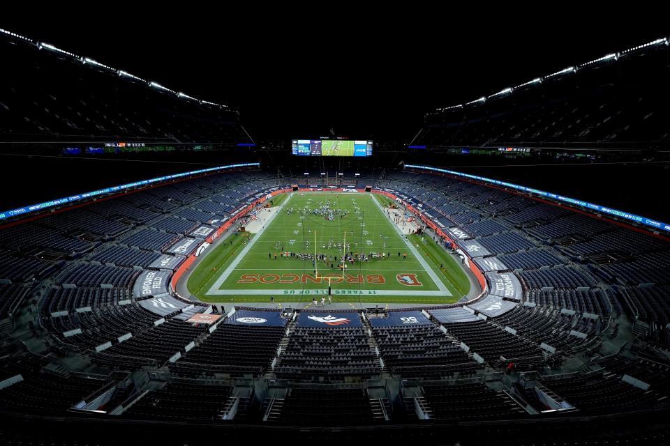 The Denver Broncos and the Tennessee Titans take the field in an empty stadium prior to an NFL football game, Monday, Sept. 14, 2020, in Denver. (AP Photo/Jack Dempsey)