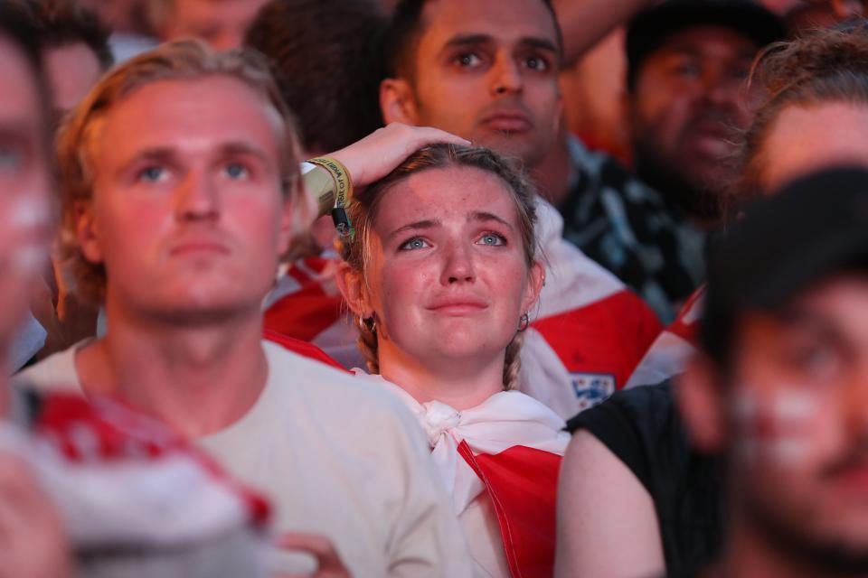 <p>England supporters in Flat Iron Square in London react as they watch the 2018 World Cup semi-final between England and Croatia in Moscow on July 11, 2018. (Photo by Daniel LEAL-OLIVAS / AFP) (Photo credit should read DANIEL LEAL-OLIVAS/AFP/Getty Images) </p>