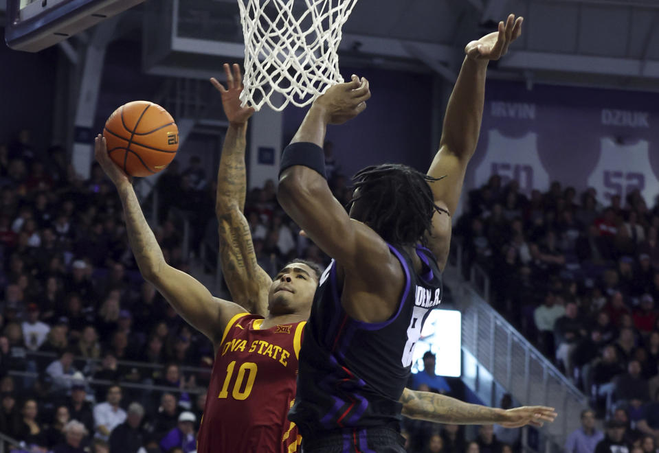 Iowa State guard Keshon Gilbert (10) shoots against TCU center Ernest Udeh Jr. (8) in the second half of an NCAA basketball game Saturday, Jan. 20, 2024, in Fort Worth, Texas. (AP Photo/Richard W. Rodriguez)