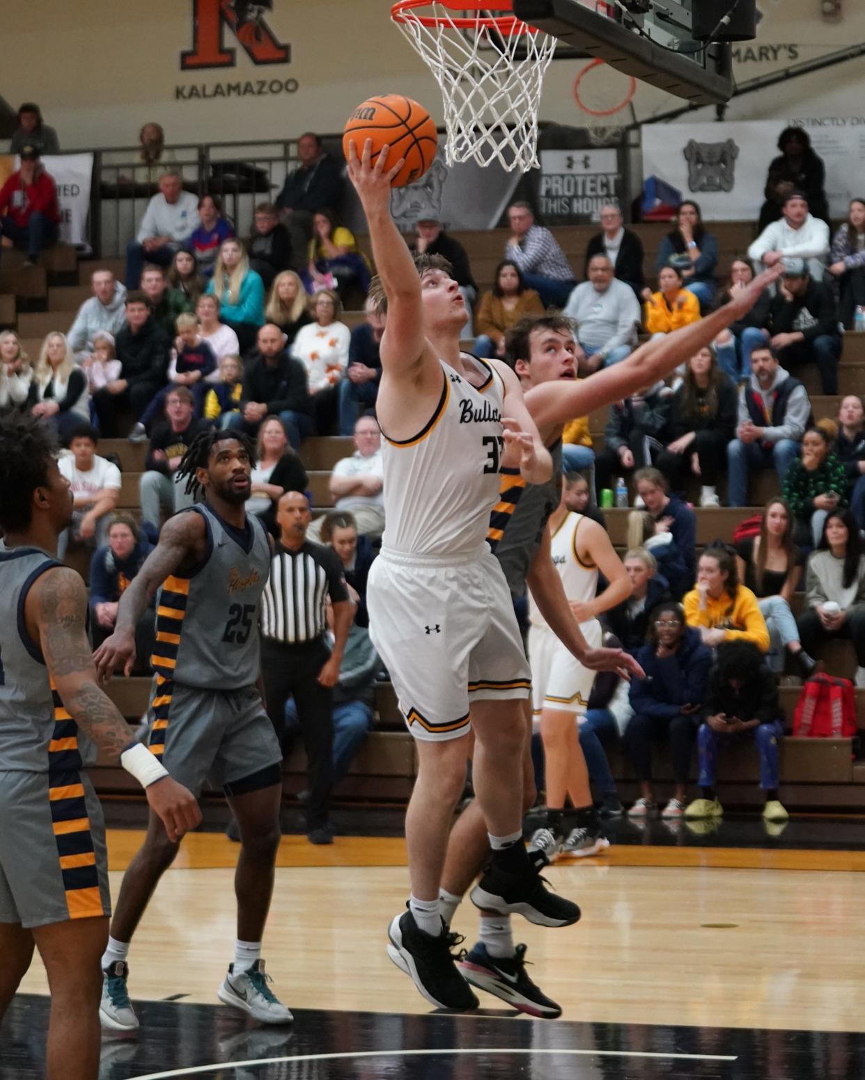 Josh Jordan gets free under the basket for Adrian College during a 60-58 men’s basketball win over Siena Heights Tuesday night.