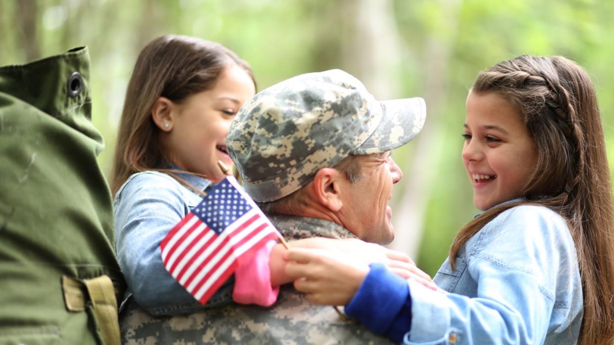 veterans day quotes  daughters hugging their veteran father