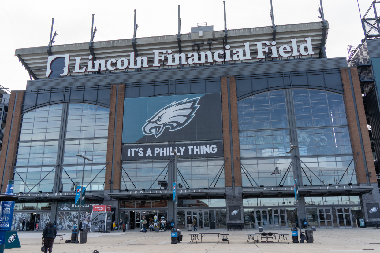 Philadelphia Eagles, Lincoln Financial Field, Philadelphia, front exterior with a sign saying 'It's a Philly Thing', a few people around the entrance