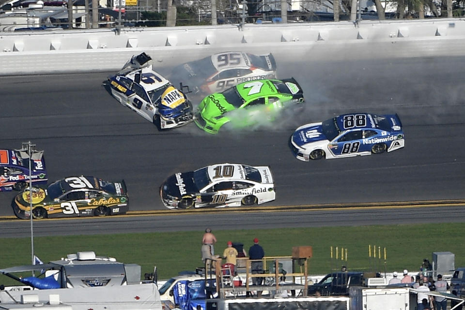 Chase Elliott (9), Kasey Kahne (95) and Danica Patrick (7) collide between Turns 3 and 4 as Ryan Newman (31), Aric Almirola (10) and Alex Bowman (88) avoid them in the NASCAR Daytona 500 auto race at Daytona International Speedway Sunday, Feb. 18, 2018, in Daytona Beach, Fla. (AP Photo/Phelan M. Ebenhack)