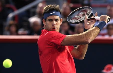 FILE PHOTO - Aug 7, 2017; Montreal, Quebec, Canada; Juan Martin del Potro of Argentina hits a shot against John Isner of the United States (not pictured) during the Rogers Cup tennis tournament at Uniprix Stadium. Mandatory Credit: Jean-Yves Ahern-USA TODAY Sports