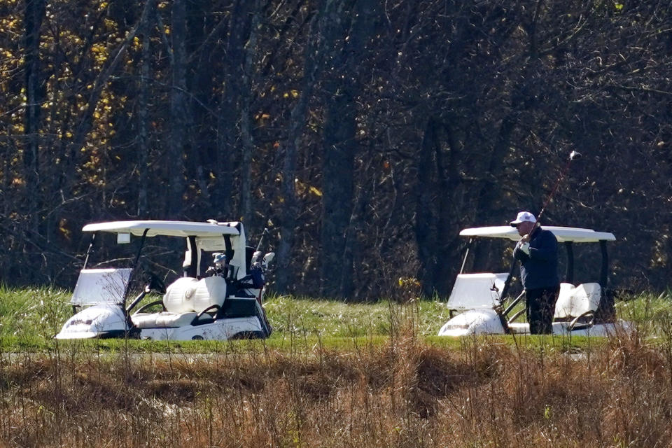President Donald Trump participates in a round of golf at the Trump National Golf Course on Saturday, Nov. 7, 2020, in Sterling, Va. (AP Photo/Patrick Semansky)
