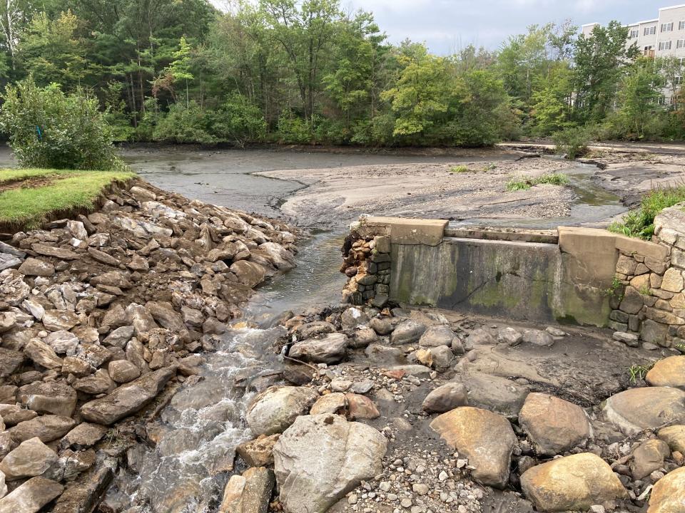 The damaged Brooks Pond Dam in Leominster, seen Wednesday.