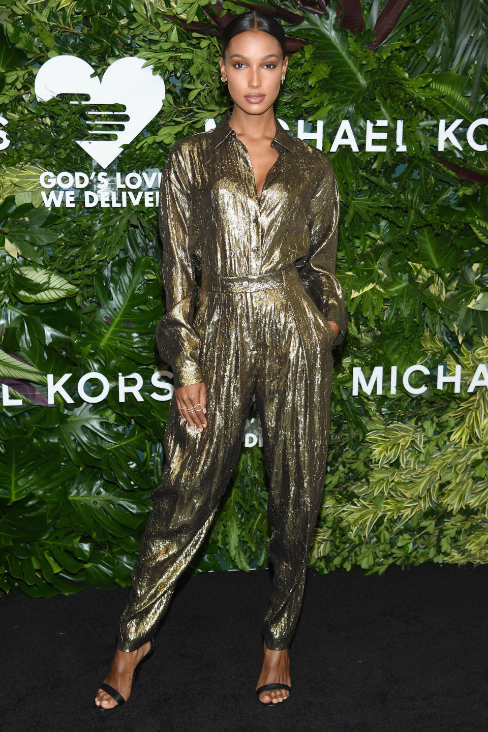 <p><strong>16 October</strong> Jasmine Tookes decided on a shimmering gold Michael Kors boiler suit. </p>