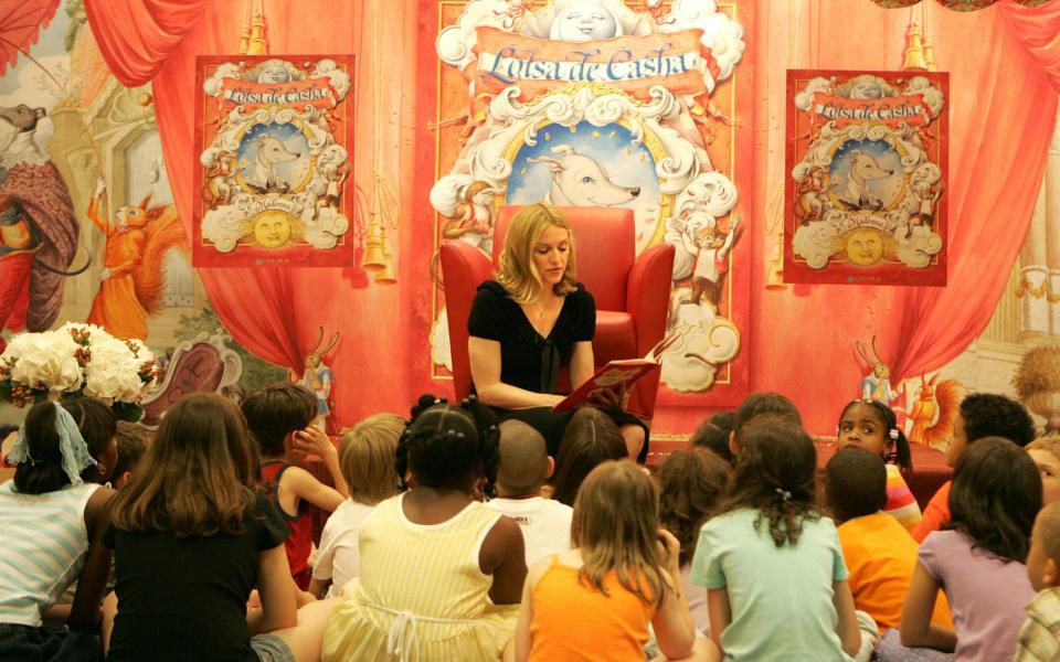 Madonna reads her latest children's book 'Lotsa de Casha' to children in a bookstore - Frank Micelotta/Getty Images North America 