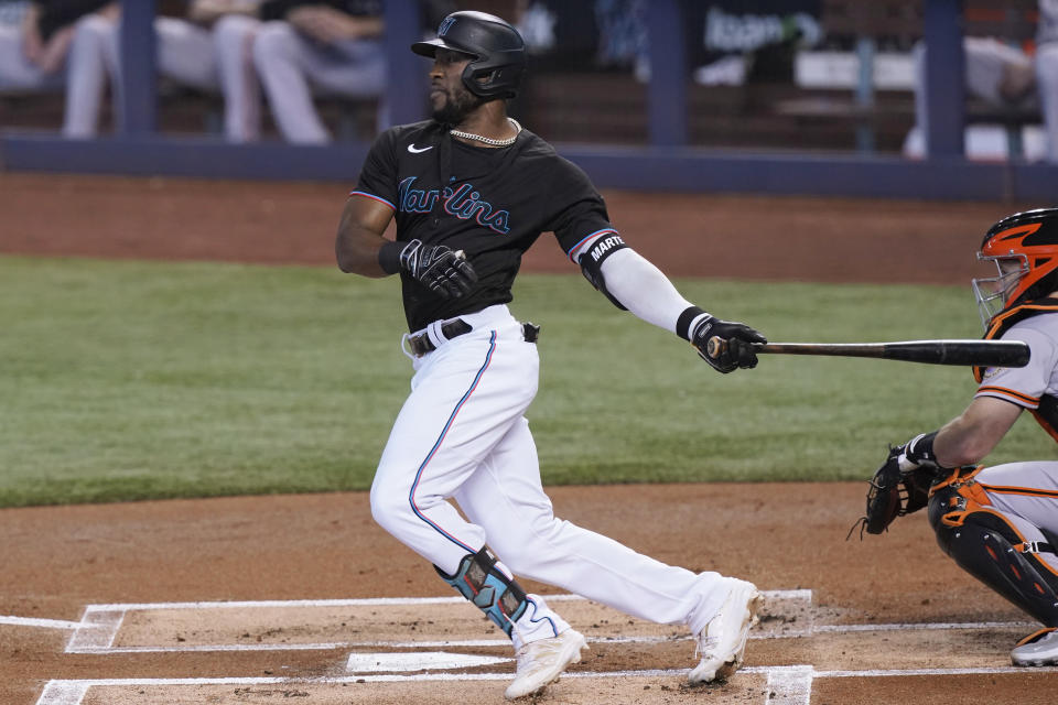 Miami Marlins' Starling Marte grounds into a force out during the first inning of the team's baseball game against the San Francisco Giants, Saturday, April 17, 2021, in Miami. (AP Photo/Marta Lavandier)