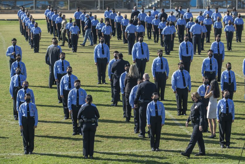 RESEDA, CA - NOVEMBER 10, 2021: Command staff from the Los Angeles Police Department and members of the LAUSD school police conduct a formal inspection of 230 cadets/students who attend the Police Academy Magnet at Reseda Charter High School. (Mel Melcon / Los Angeles Times)