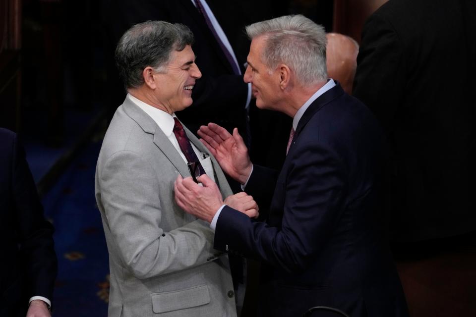 Jan 6, 2023; Washington, DC, USA; Rep. Andrew Clyde (R-Ga.), left, and Rep. Kevin McCarthy (R-Calif.) speak after the thirteen round of voting for Speaker of the House.