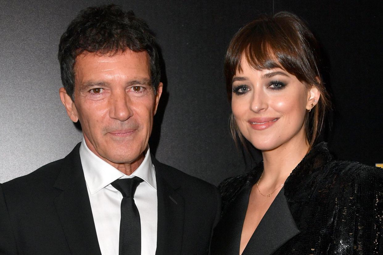 Antonio Banderas, winner of the Hollywood Actor Award, and Dakota Johnson pose in the press room during the 23rd Annual Hollywood Film Awards at The Beverly Hilton Hotel on November 03, 2019 in Beverly Hills, California.