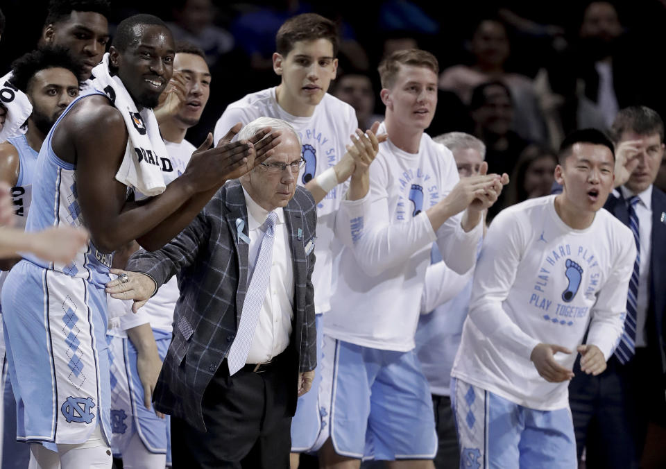 North Carolina head coach Roy Williams and players react after a basket against Miami during the first half of an NCAA college basketball game in the Atlantic Coast Conference men’s tournament Thursday, March 8, 2018, in New York. (AP Photo/Julie Jacobson)