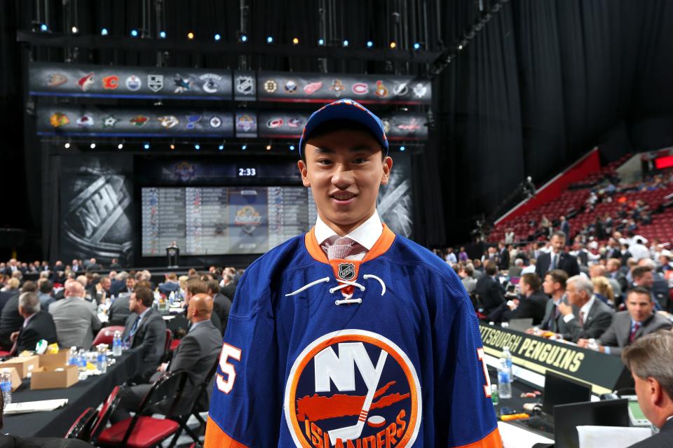 SUNRISE, FL - JUNE 27:  AnDong Song reacts after being selected 172nd overall by the New York Islanders during the 2015 NHL Draft at BB&T Center on June 27, 2015 in Sunrise, Florida.  (Photo by Bruce Bennett/Getty Images)