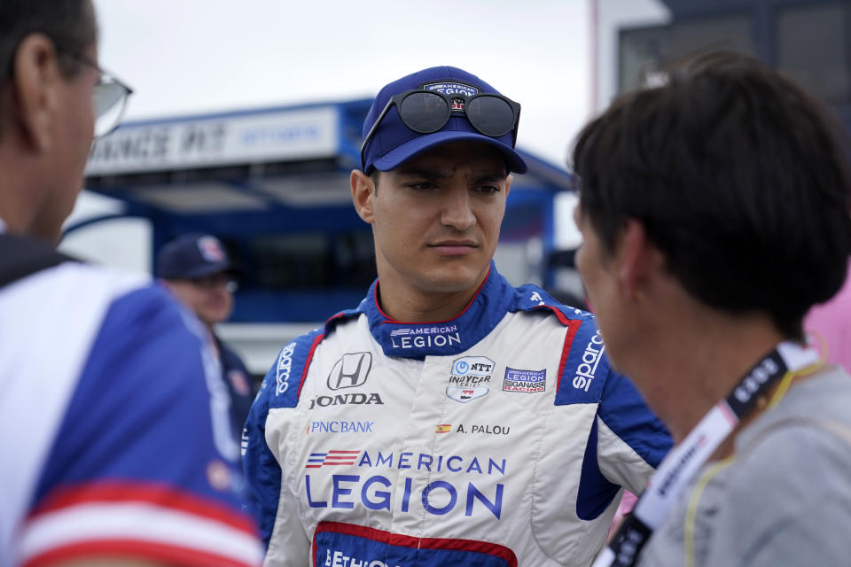 Alex Palou prepares before the start of an IndyCar auto race at World Wide Technology Raceway, Sunday, Aug. 27, 2023, in Madison, Ill. (AP Photo/Jeff Roberson)