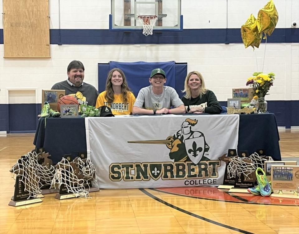 Mackinaw City seniors Larissa and Lars Huffman officially signed to compete in athletics at St. Norbert College (Wis.) during a ceremony in their high school gymnasium on Wednesday. In this photo with the two Mackinaw City twins are their parents, Jake and Heather Huffman.
