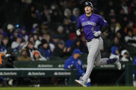 Colorado Rockies' Michael Toglia runs the bases after hitting a two-run home run during the seventh inning of a baseball game against the Chicago Cubs, Tuesday, April 2, 2024, in Chicago. (AP Photo/Erin Hooley)