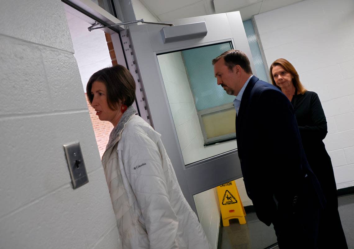 Assistant Principal Emily Hardee, Douglas Congdon and Lori Roach exit a restroom facility with no heating or cooling at Brentwood Elementary School on Wednesday, Oct. 12, 2022, in Raleigh, N.C. When the humidity is high, Hardee said, slippery tiles in the restroom area can present a safety hazard. Brentwood Elementary is one of seven schools that would undergo renovations in a $530.7 million bond referendum on the Nov. 8 ballot.