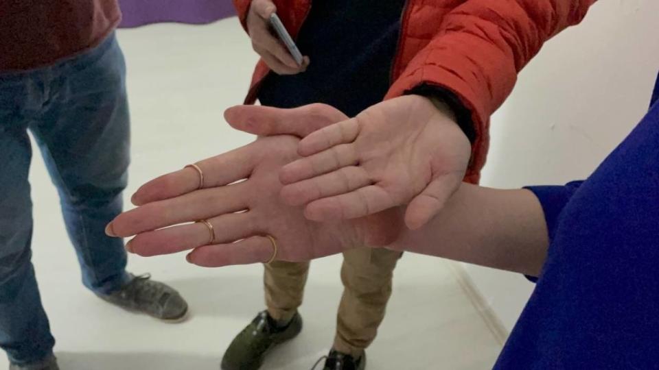 Rumeysa Gelgi's hand in comparison to someone else's