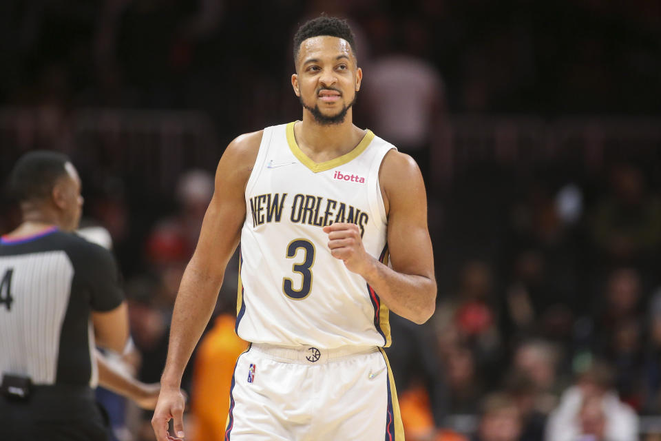 New Orleans Pelicans guard CJ McCollum celebrates in the second half of an NBA basketball game against the Atlanta Hawks, Sunday, March 20, 2022, in Atlanta. (AP Photo/Brett Davis)